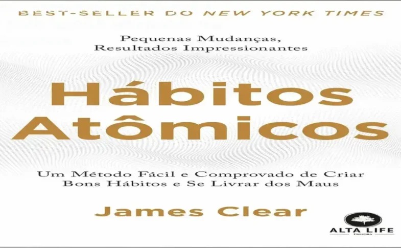 Livro físico Hábitos Atômicos de James Clear aberto mostrando diagramas internos
